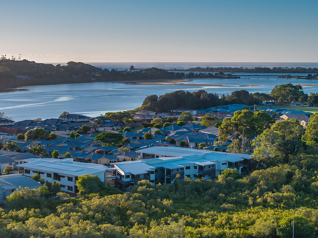aerial view of Assisi apartment building showing proximity to North Creek and Missingham bridge to East Ballina