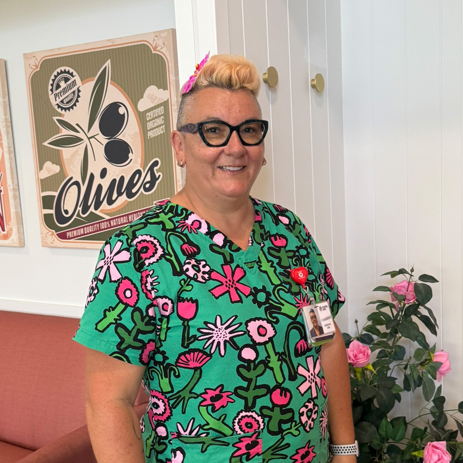 staff member wearing bright scrubs