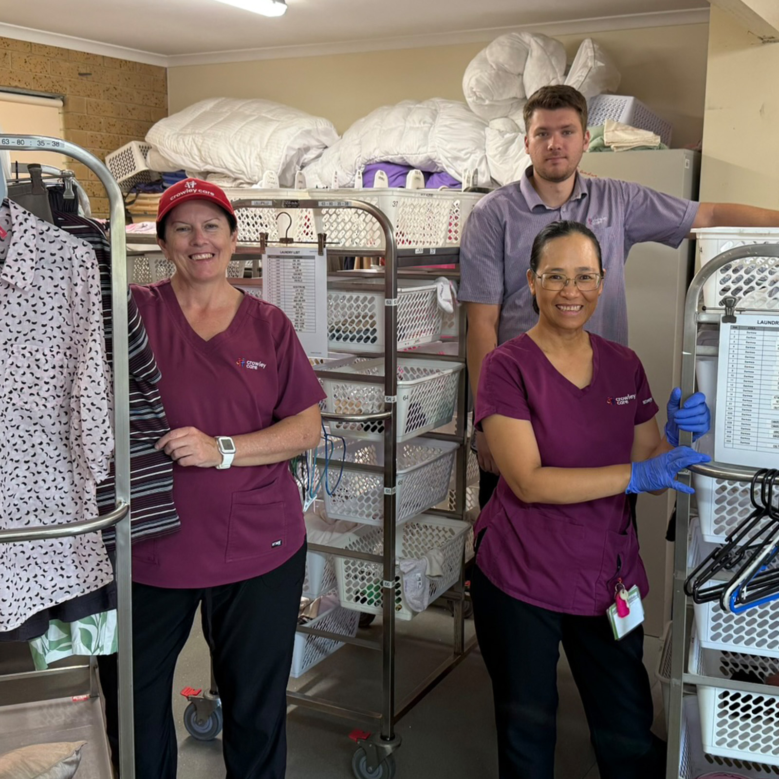3 staff members in the laundry