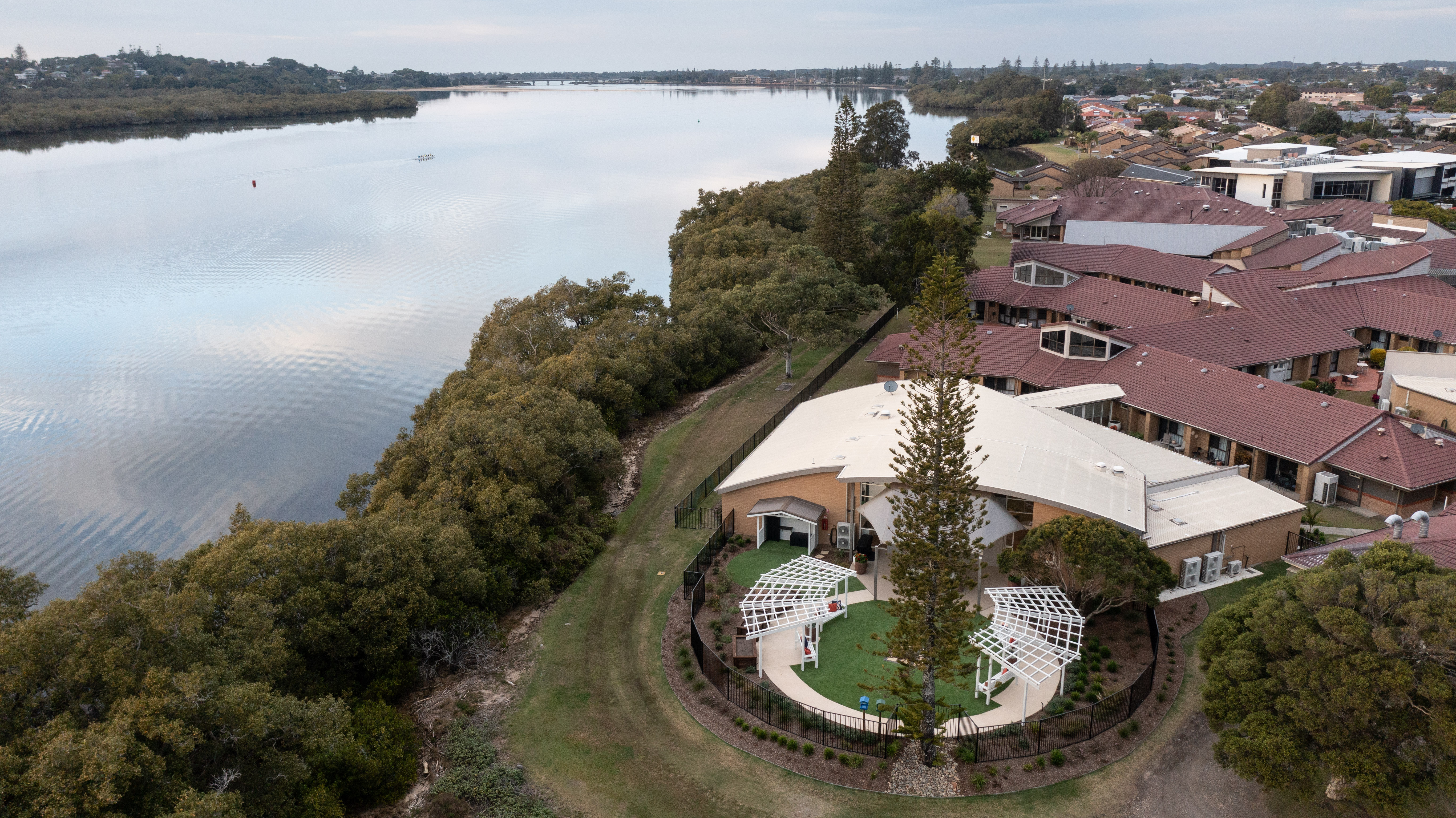 Aerial shot of Crowley Care Residential Care building and gardens adjoining North Creek